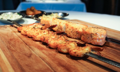 Shrimp and salmon: Gulf shrimp and seasoned salmon are skewered and served tableside.