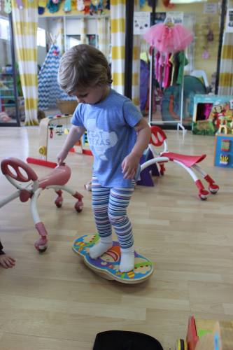 A child finds her balance at Toybrary Austin, a toy-lending library