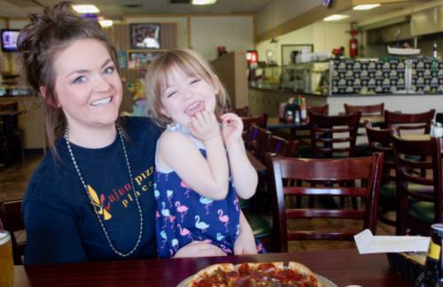 Samantha Dartez, whose father owns Cajun Pizza Place, served part-time at the restaurant and brought her daughter, Zoey Silva. 