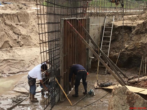 Contractors pour concrete walls for the Buffalo Springs Drive bridge on April 9. 