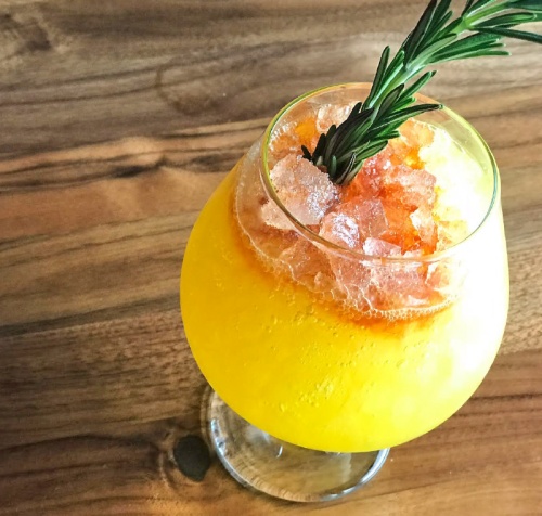 Acapulco Gold ($12)nThe cocktail consists of gin, ginger liqueur, turmeric cordial, lemon, aromatic bitters and seared rosemary.