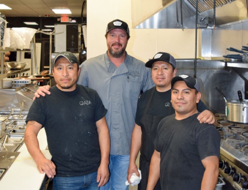 Hembree (second from left) and chef Juan Garcia (left) pose with their kitchen staff ahead of the April 19 soft opening.