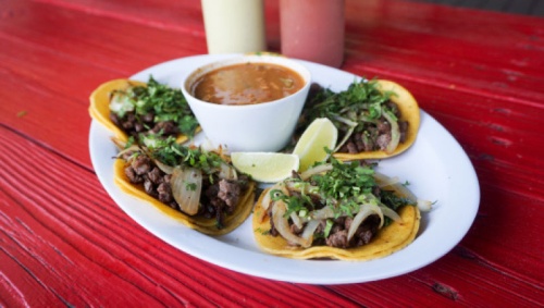 Street tacos ($7.99) This order of tacos consists of five small steak tacos, with grilled onion, cilantro, lime and a side of charro beans.