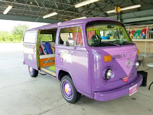 The organizationu2019s purple bus was inspired by Holly Munsingeru2019s personality.