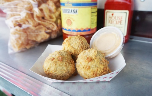 Boudin balls ($4 for three) This order consists of boudin sausage and rice, breaded and deep-fried. It is served with Sriracha ranch sauce.