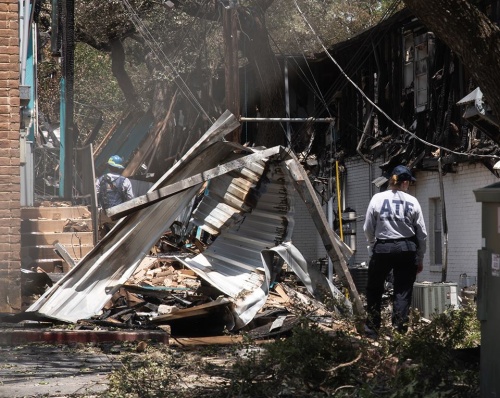 Agents from the Bureau of Alcohol, Tobacco, Firearms and Explosives investigate the San Marcos apartment complex fire on Saturday afternoon.