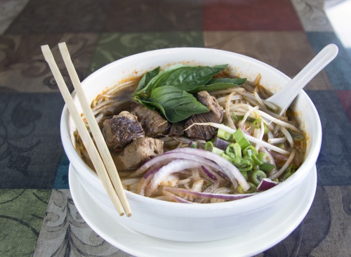 Guay Tiew, $9, is a Thai noodle soup with rice noodles, bean sprouts, red onions, and cilantro in beef broth with an option of stewed beef or steamed chicken.