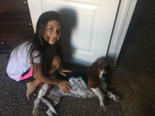 Camryn Escobedo poses with her dog, Bia.