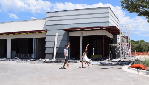 Shivam Patel and Denise Cua, owners of Perch Dentistry, stand outside their facility. It is under construction, and the business is scheduled to open this fall.