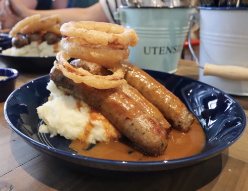 The menu at Fish & Fizz consists of British favorites, such as bangers and mash.