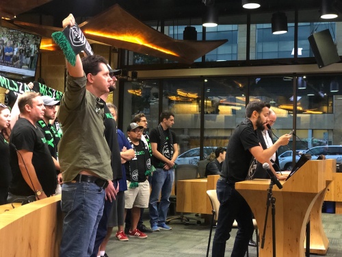 Derek Ensign speaks to Austin City Council with a group of MLS supporters during the council's meeting on Thursday, Aug. 9.