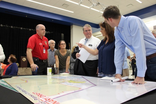 Congressman John Culberson R-Houston and Harris County Emergency Services District 48 Public Information Officer Simon Van Dyk speak with residents about the proposed projects for the Barker Reservoir watershed.