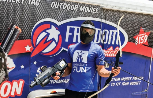 Co-owner Zack Masters displays some equipment at the companyu2019s Leander home office. Freedom Fun USA was started five years ago in the family garage.