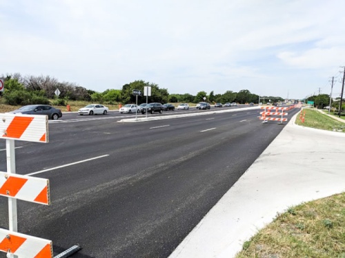 RM 620 wideningnWilliamson County and TxDOT officials on July 23 cut a ribbon to open the new six-lane RM 620. The new widened highway segment stretches 2.74 miles from Cornerwood Drive to Deep Wood Drive and includes a raised median and curb-and-gutter improvements.