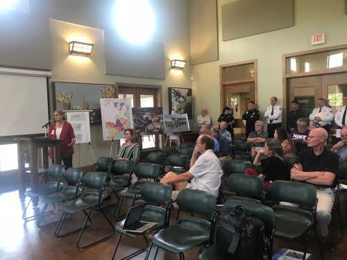 Residents listen to Austin Fire Department Assistant Director Ronnelle Paulsen discuss a potential new fire and EMS station in Sunset Valley.