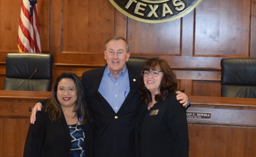 Deysi Crespo (left), executive director for Katy Christian Ministries, Katy Mayor Chuck Brawner (center) and Carolyn Chandler (right), grant officer for Katy Christian Ministries pose for photos at a press conference announcing the grant Wednesday at 8:30 a.m.