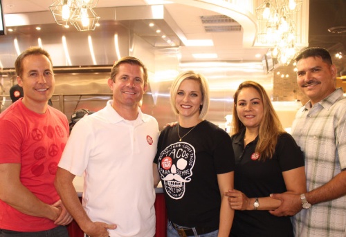 From left: Tyler Robison, Steve Beck and Kristy Beck enjoyed the al carbon tacos produced in Maricela and Ruben Alvarezu2019s backyard so much that they encouraged the Alvarezes to go into the restaurant business with them.