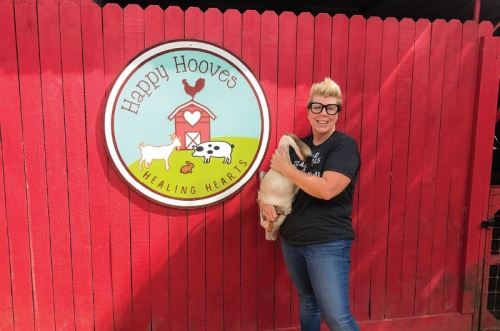 Happy Hooves Healing Hearts founder Kris Krolczyk holds shelter resident Eggbert the goose.