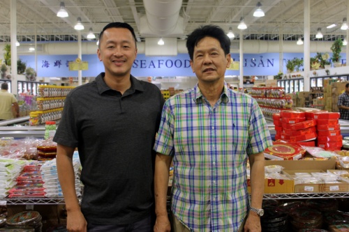 The Lee family, including Pat (left) and his father, Tom, run MT Supermarket in North Austin, which is still the largest international grocery store in Central Texas.