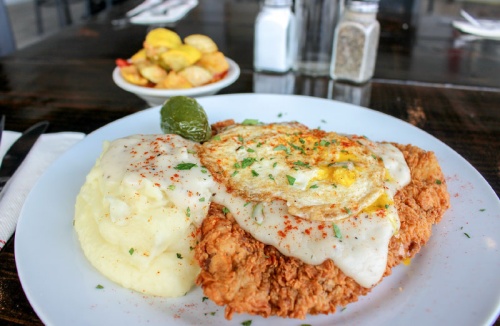 Chicken-fried steak is served with gravy nand sides. Make it Allendaleu2019s style and add na fried egg and grilled jalapeno for $2.50. 