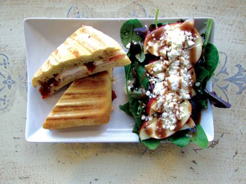 Opera Cafe & Coffeehouse serves lunch dishes, such as the tomato and mozzarella paniniu2014made with fresh mozzarella, pesto, tomato and basil on Ciabatta breadu2014and the Opera Salad with feta cheese, sliced apples, onions and a balsamic vinaigrette. Breakfast options are available as well.