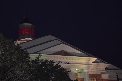 The lights on the steeple at Katy City Hall glow in holiday colors.