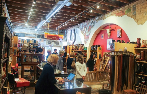 Shoppers walk through Heritage Boot Co.  on South Congress Avenue. 