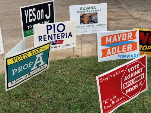 Election signs welcome voters at the entrance to Fiesta Mart in Austin on Tuesday, Nov. 6. 