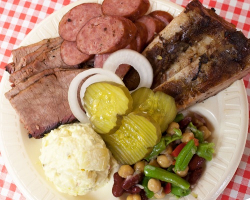Dozieru2019s menu includes beef brisket, sausage and ribs along with a three-bean salad and potato salad.