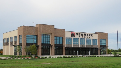 More than 30 Newmark Homes staff will work at the new building and about 12,000 square feet of retail or restaurant space is available at the site. 