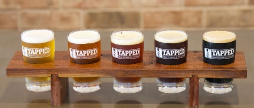 Tapped beer flight ($10.99) Diners can select any five 5-ounce beers off the tap wall to create a flight, or sampler of beers.