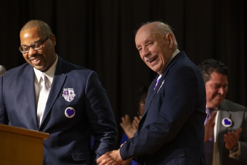 Gus Garcia (right) smiles during the dedication of the Gus Garcia Young Men's Leadership Academy in 2014. Garcia died Dec. 16. 