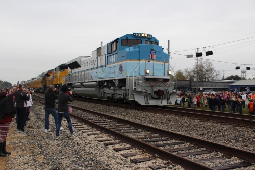 The train carrying the remains of former President George H.W. Bush passes through the city of Magnolia.