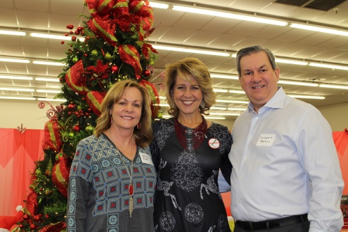 Property owners Shelley and Robert Beall (left and right) donated their previously empty retail space for the GRACE Christmas Cottage, and Shonda Schaefer (middle) is the chief executive officer of GRACE.