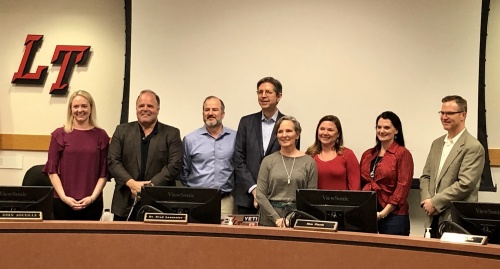 Lake Travis ISD board of trustees recognized Deputy Superintendent Mary Patin (fifth from left) Dec. 19 for her service to the district. Patin's resignation will be effective at the end of the month.