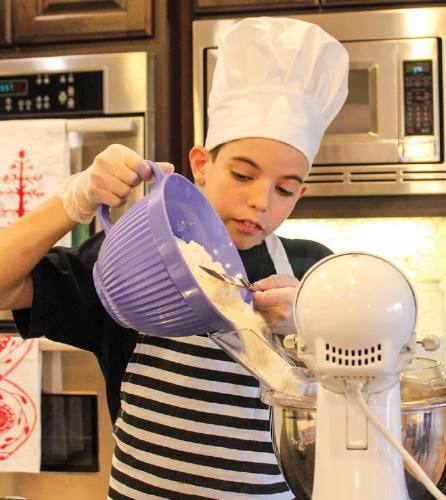 One of Logan Smith's favorite parts about baking is tasting the cookies.