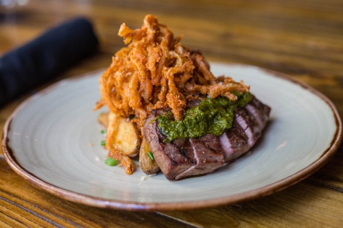 District Kitchen + Cocktails will open a second location next spring and serve entrees such as Texas Wagyu Steak.
