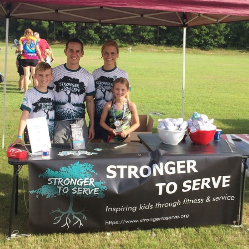Founders Jeff and Teri Schmidt (center) began Stronger to Serve in Montgomery County in 2017 with the idea of combining physical activity with community involvement. 