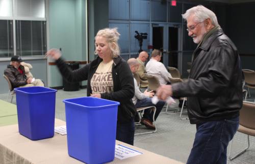 Participants in a public meeting held by the city of Cedar Park provide feedback on desired waste management services.