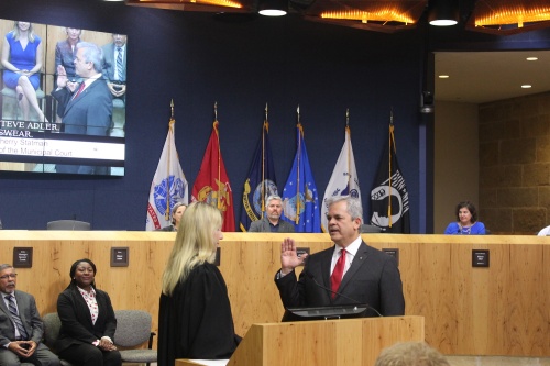 Mayor Steve Adler, right, takes his oath of office at the Jan. 7 Austin City Council inauguration ceremony. 