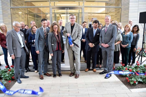 American Bureau of Shipping president, chairman and CEO Christopher J. Wiernicki, center, cuts the ribbon for the grand opening of the ABS global headquarters at CityPlace in Springwoods Village.