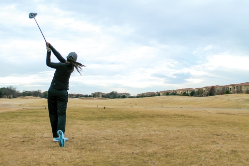 Liberty High School senior Alison Fong practices her swing in December at Ridgeview Ranch Golf Course in Plano.