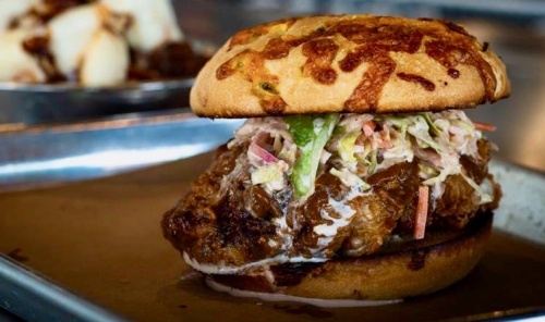 Industry's chicken sandwich is smoked, fried, then covered in hot sauce and ponzu slaw.