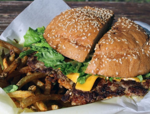 Chucho burger ($12.99): A half-pound beef burger patty is mixed with chopped bacon, onions and jalapenos; blanketed with American cheese, lettuce, tomatoes, pickles and condiments; and served on a large grilled bun with fresh-cut fries. 