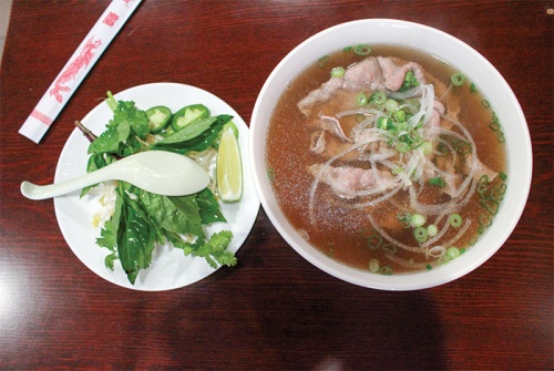Pho tai ($7.99) features beef broth, rice noodles and sliced, raw rib-eye steak served with a side of bean sprouts, basil, cilantro, lime and jalapenos. Chicken broth and vegetarian broth are also available upon request.