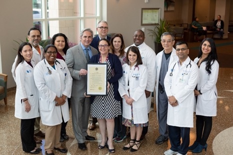 Jeff Wagner, mayor of Pasadena, presents Kelsey-Seybold Clinic u2013 Pasadena staff with a proclamation in recognition of the clinicu2019s 70th anniversary.