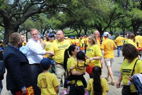 Houston Firefighter's Union President Marty Lancton greets attendees at a rally in front of City Hall on March 19. 