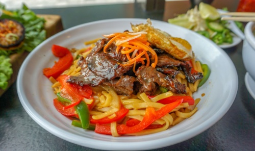 Garlic noodles ($19-$30) nLo mein garlic noodles are topped with grilled beef, lobster or gulf shrimp and tossed in garlic and butter.u00a0