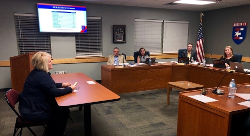 Laurie Lee, executive director of human resources for Eanes ISD, presents staff salary and benefit information to the board of trustees April 23.