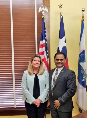 Fort Bend County Judge KP George stands with new county tax assessor-collector Carrie Surratt.